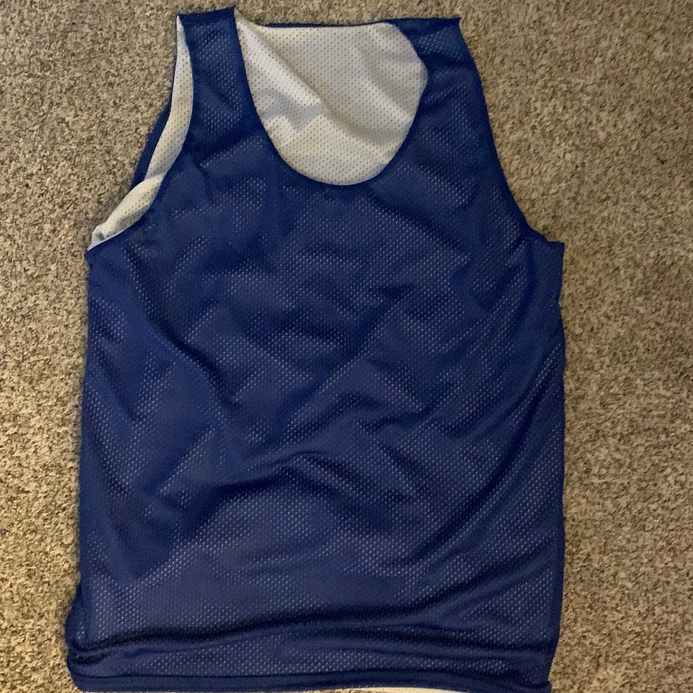 Plain blue and white basketball practice jersey